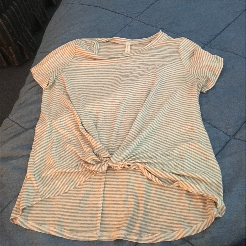 Never worn T shirt with front tie. Size Small